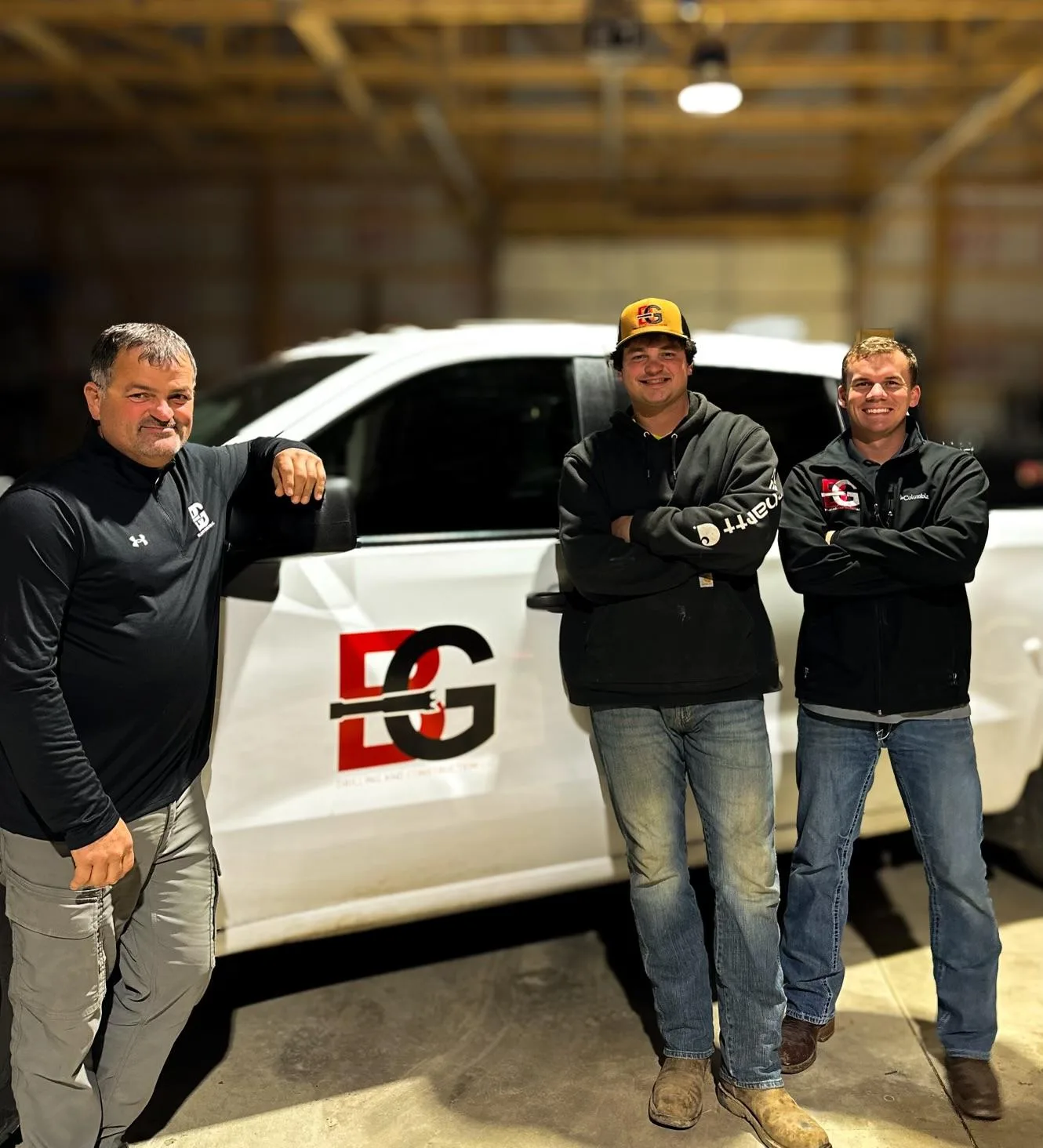 The B&G Drilling & Construction crew in front of a branded truck
